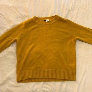 A yellow sweater, by divide H&M